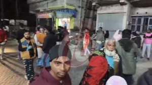 Crowded street scene with people walking around
