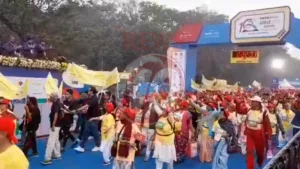 Marathon participants celebrate under finish line.