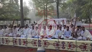 People singing in a serene outdoor setting.