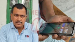 Man holding smartphone with apps visible