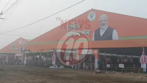 Political rally tent with large portrait and stages.