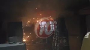 Warehouse fire causes visible damage inside.