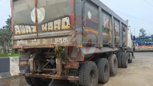 Large gray dump truck parked roadside